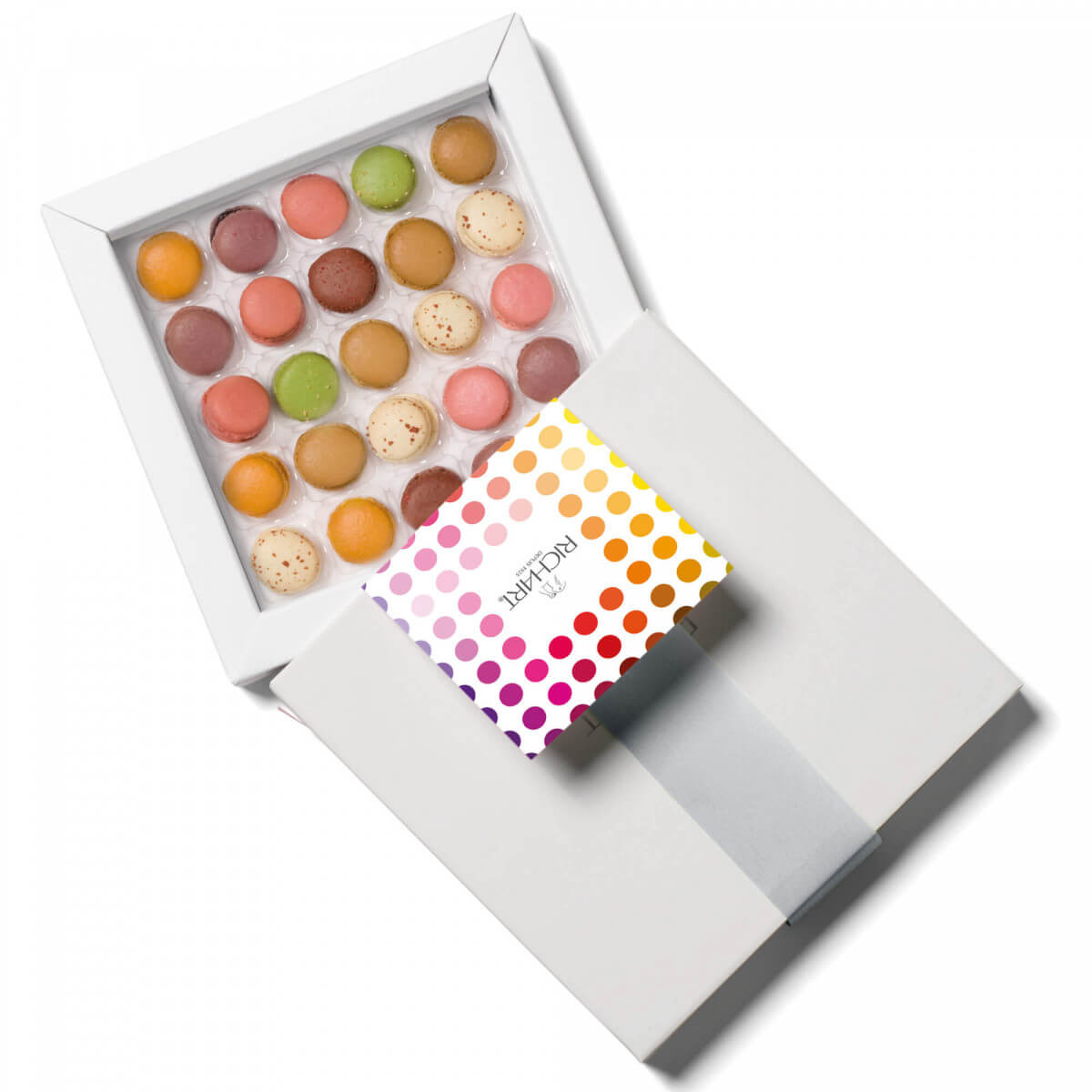 Box of 25 mini French Macarons. The tasting experience in an unique tiny macaron. Pistachio, caramel, vanilla, raspberry...