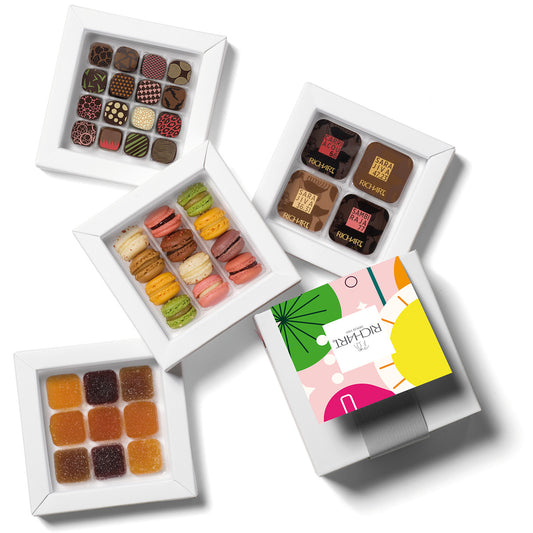 Box of gourmet treats, 32 plain and filled chocolates, 12 mini-macarons and 9 French pâtes de fruits. High-end products presented in an elegant gift box.