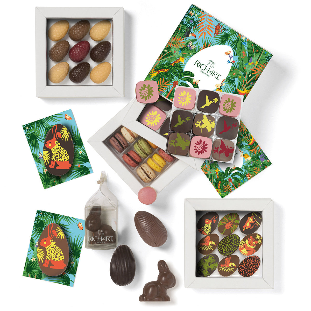 Easter basket, 9 half-eggs, 11 filled eggs, 18 chocolates, 2 morsels, 2 filled rabbits and 12 macarons. Gourmet products in a refined ballotin.