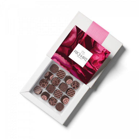 Box of 16 Filled Floral Dark Chocolates. Silky ganaches or caramel base : rose, lavender, violet, neroli…Hand-crafted in France.
