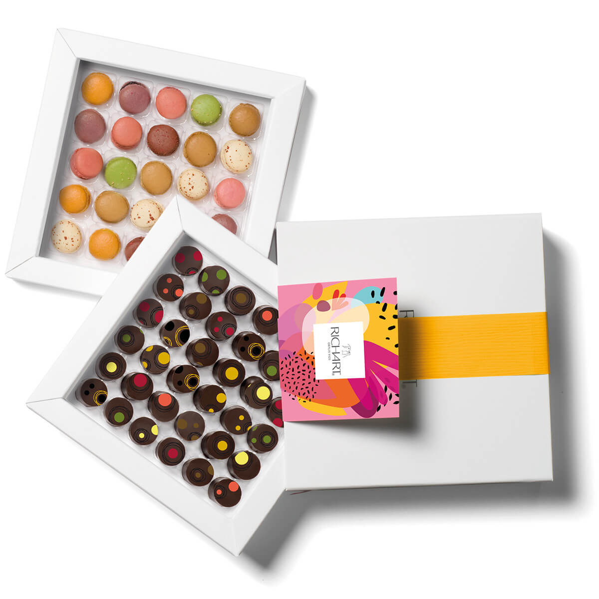 Box of 36 fine Chocolates + 25 mini macarons. 7 flavors of Filled Dark Chocolates and Assortment of 8 variety of Macarons. Handmade in France.