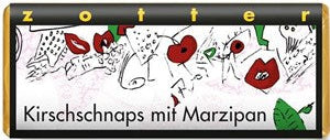 Packaging of Kirsch schnaps with marzipan, featuring musical notes and poppy flowers.