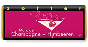 Zott Marc de Champagne + Himbeeren packaging with pink label and gold accents